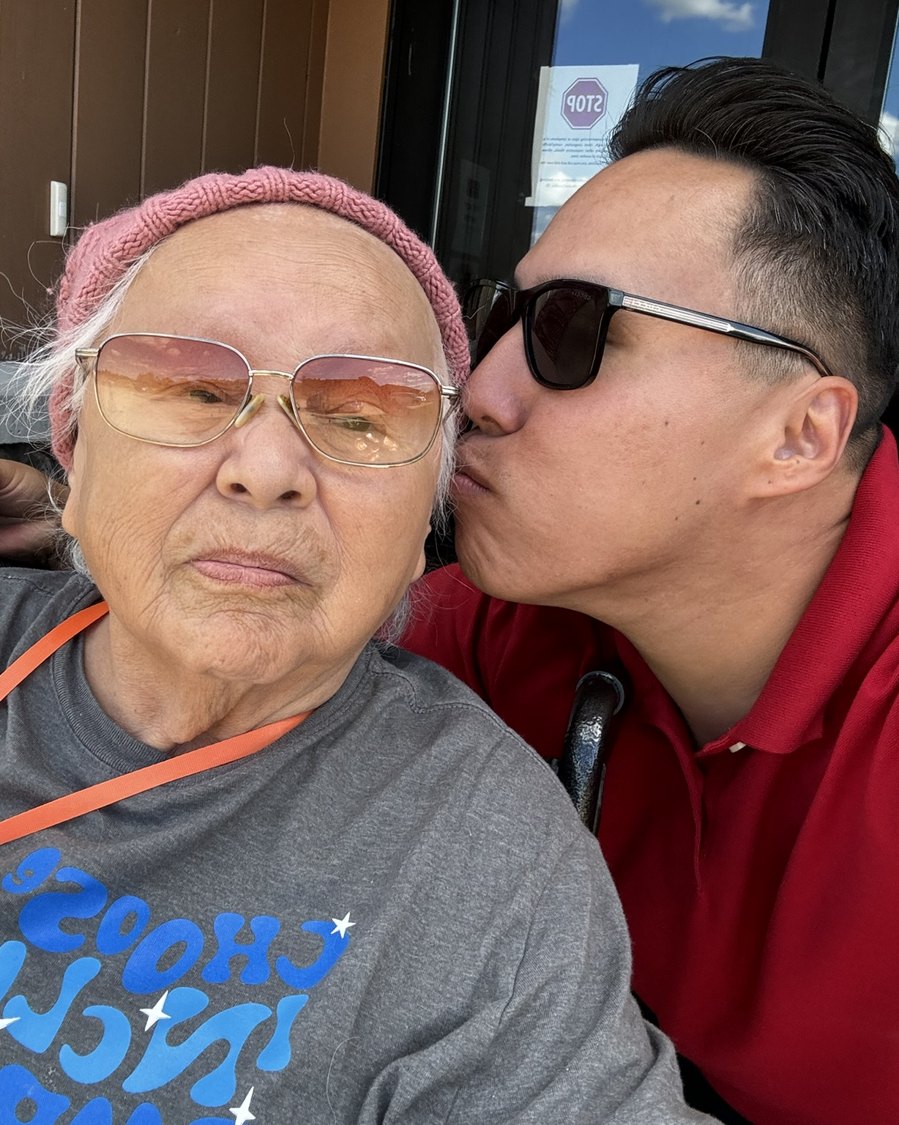 Josh kissing a family member on the cheek