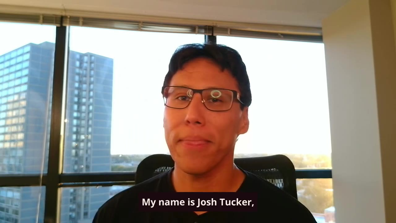 Josh Tucker at his window in Chicago